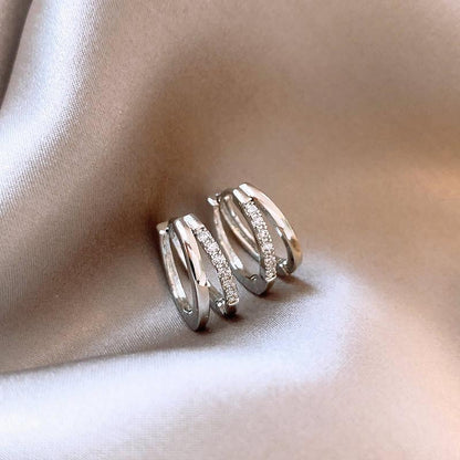 pure titanium steel, hypoallergenic double-loop stud earrings.